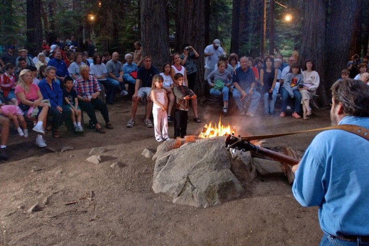 a group of people walking in front of a crowd