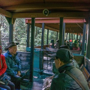 a group of people sitting at a train station