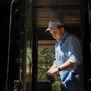 a man standing in front of a window