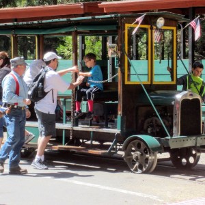 a group of people standing in front of a bus