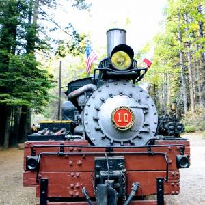 a train that is sitting on a bench