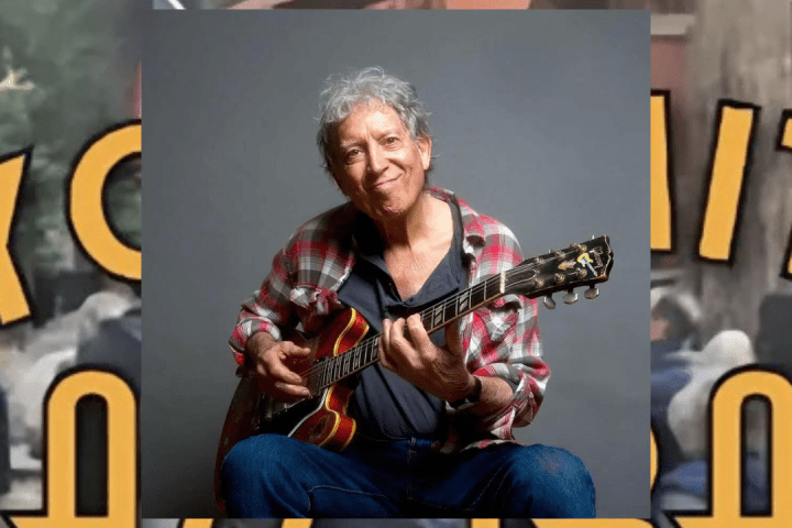 Elvin Bishop sitting on a bench