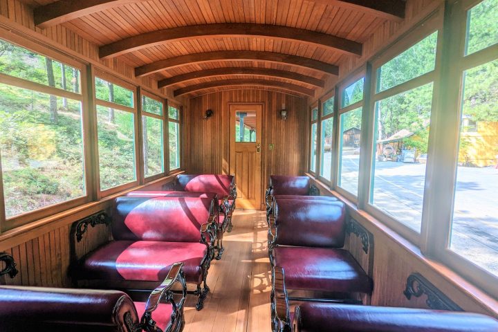 a living room filled with furniture and a large window