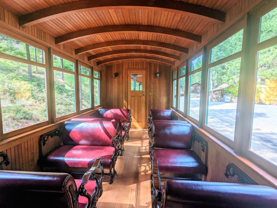 a living room filled with furniture and a large window